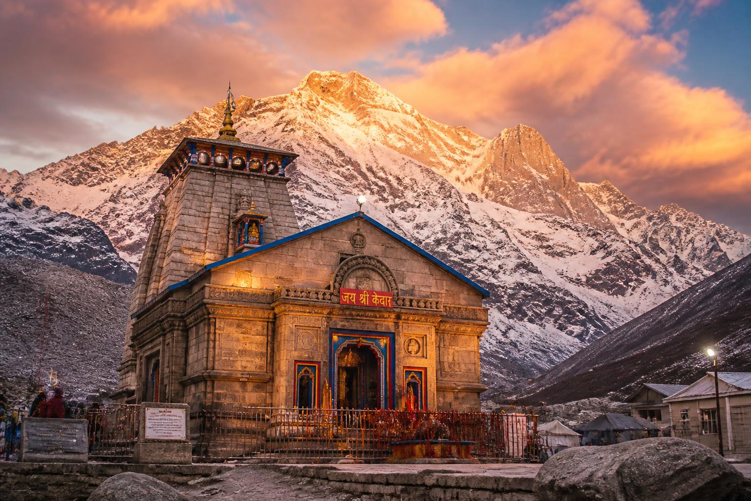 Kedarnath temple at sunrise with snow-capped Himalayan peaks